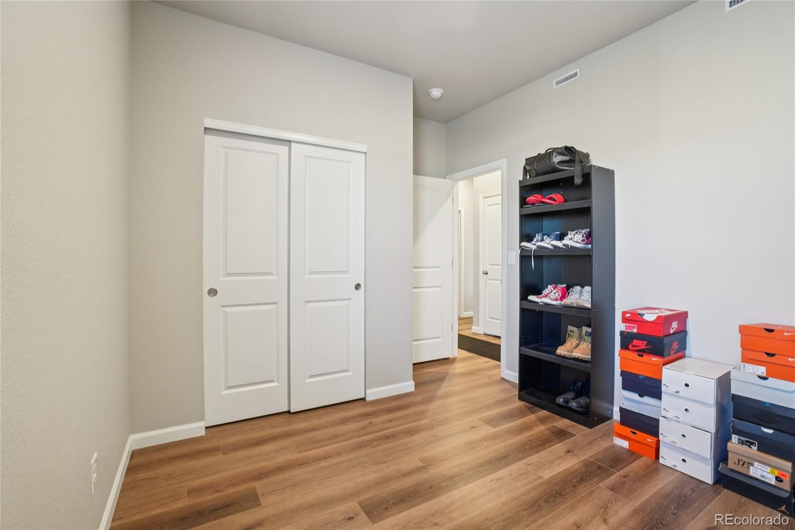 1025 Payton Avenue Fort Lupton, CO 80621 - Photo 13 of 30 a view of room with toys and wooden floor