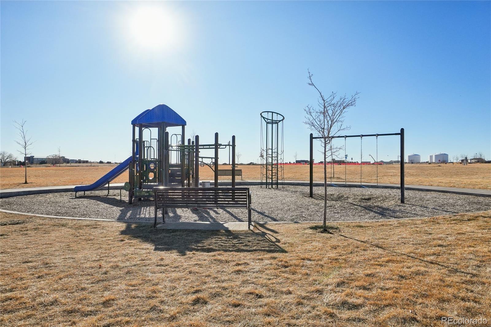 1025 Payton Avenue Fort Lupton, CO 80621 - Photo 25 of 30 a view of a slide with a bench