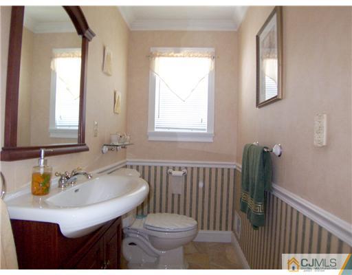 29 West Cliff Road Colonia, NJ 07067 - Photo 12 of 25 a bathroom with a sink and a toilet