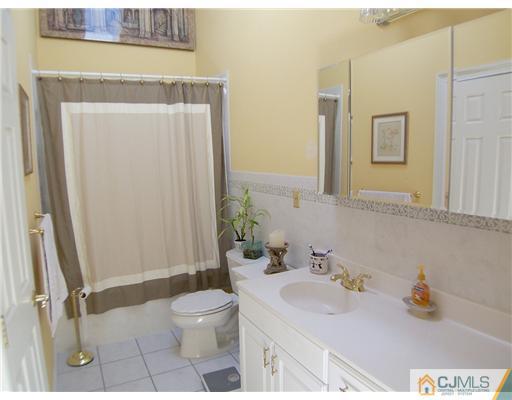 29 West Cliff Road Colonia, NJ 07067 - Photo 14 of 25 a bathroom with a sink a toilet and shower