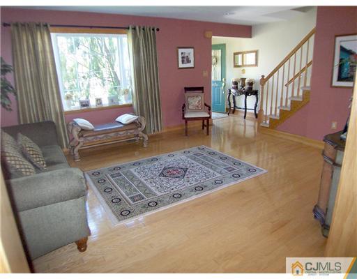 29 West Cliff Road Colonia, NJ 07067 - Photo 3 of 25 a living room with furniture and a rug