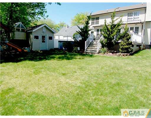29 West Cliff Road Colonia, NJ 07067 - Photo 25 of 25 a front view of a house with a yard and garage