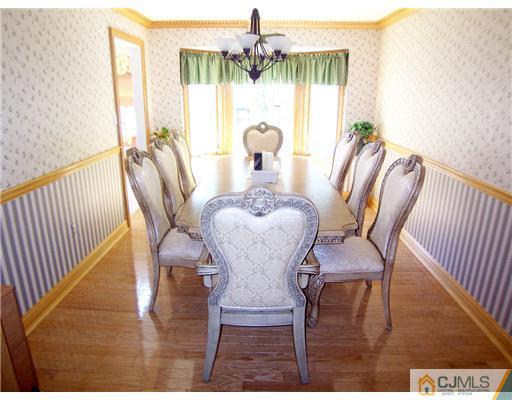 29 West Cliff Road Colonia, NJ 07067 - Photo 5 of 25 a view of a dining room with furniture window and wooden floor