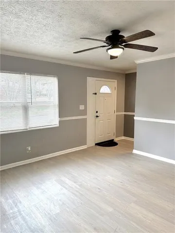 a view of an empty room with a window