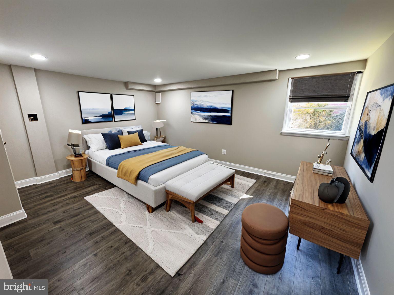 5612 Namakagan Road Bethesda, MD 20816 - Photo 13 of 34 a bedroom with a bed and a flat screen tv