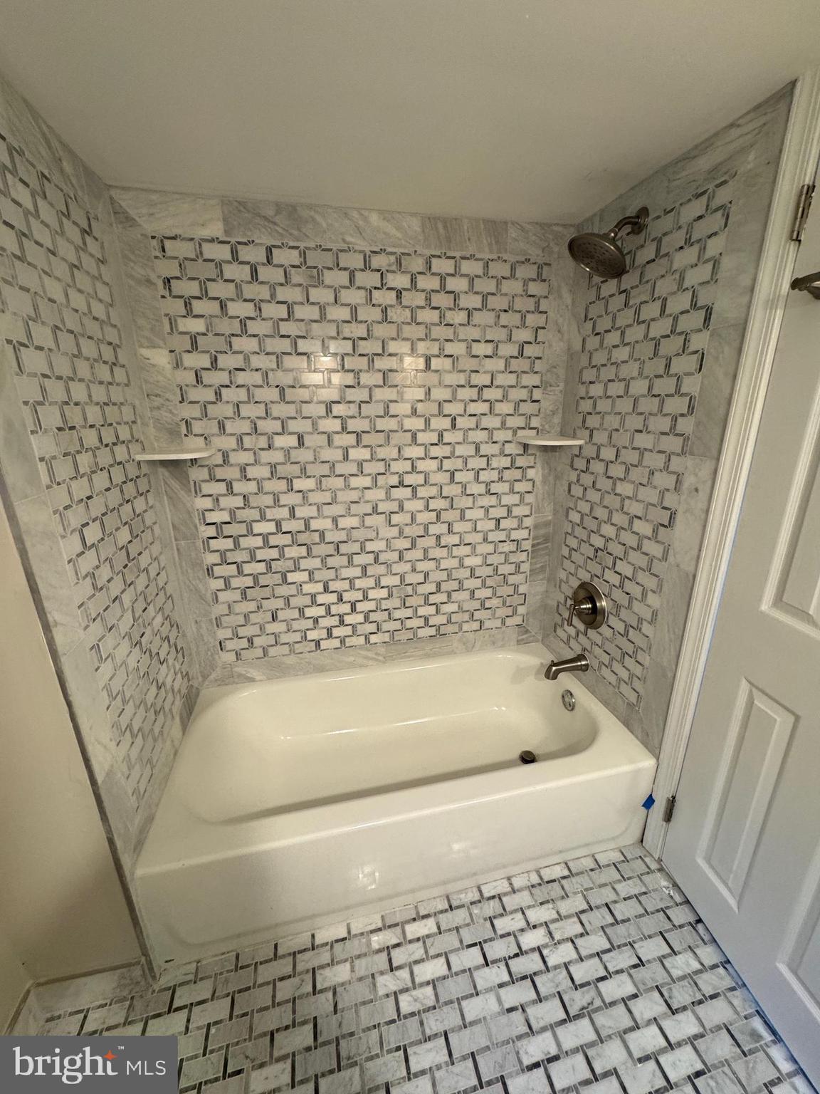 5612 Namakagan Road Bethesda, MD 20816 - Photo 15 of 33 a bathroom with a bathtub and a shower