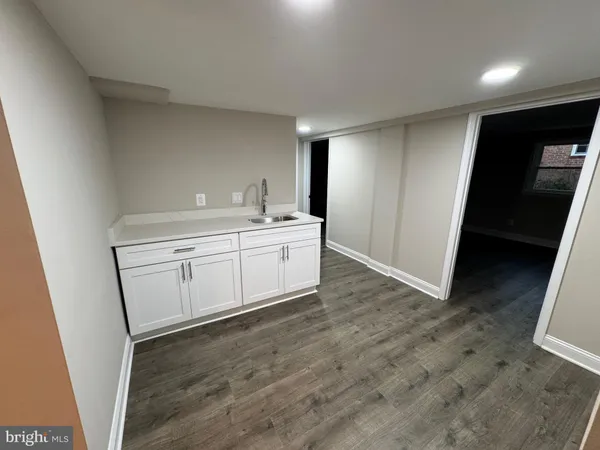 a view of a storage & utility room with a sink