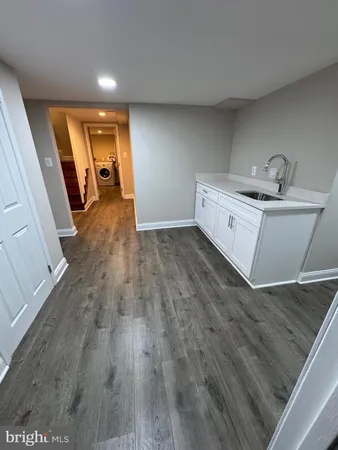 a view of a storage & utility room with wooden floor