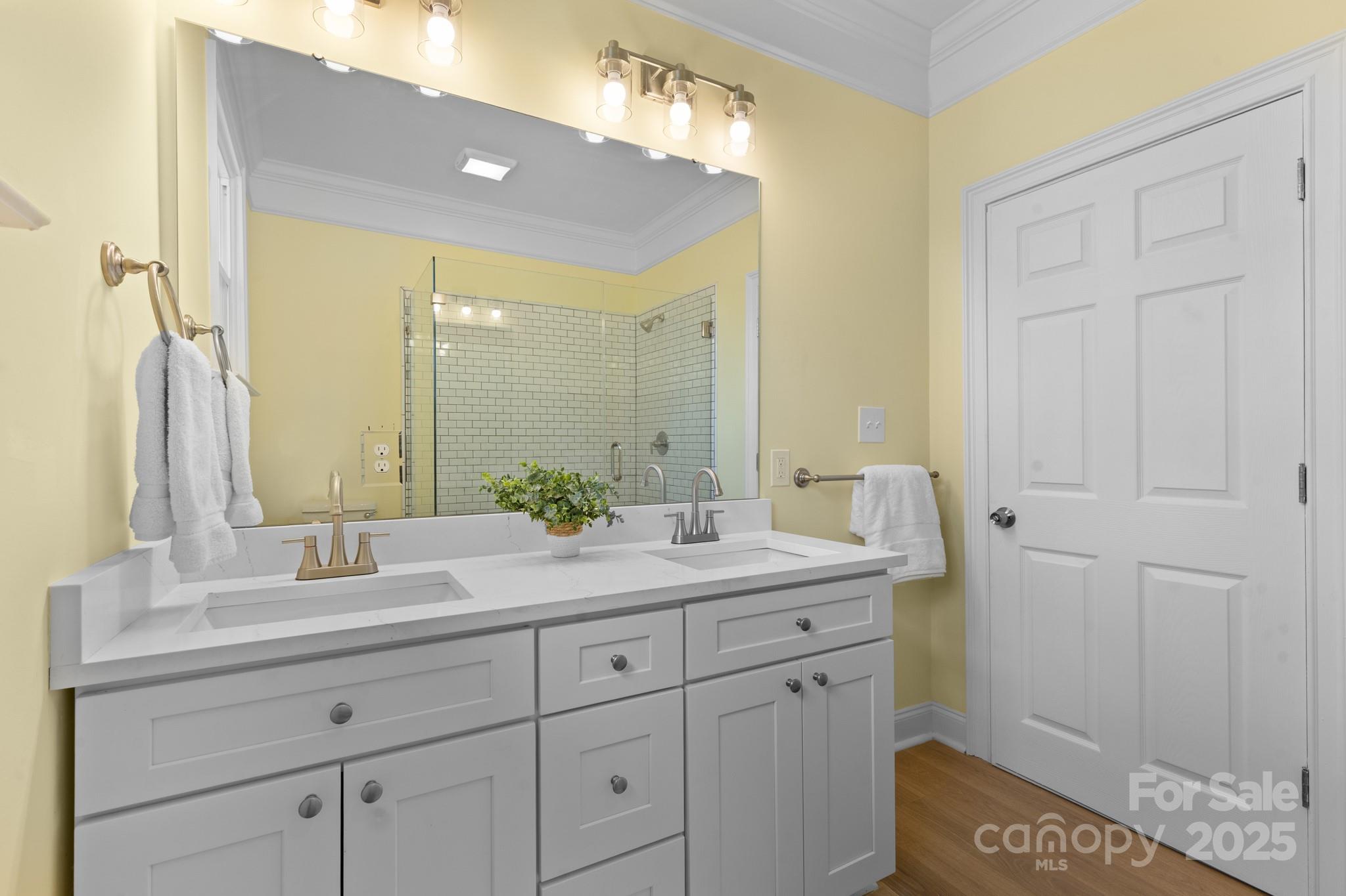 304 West Gay Street Lancaster, SC 29720 - Photo 16 of 28 a bathroom with a sink and a mirror