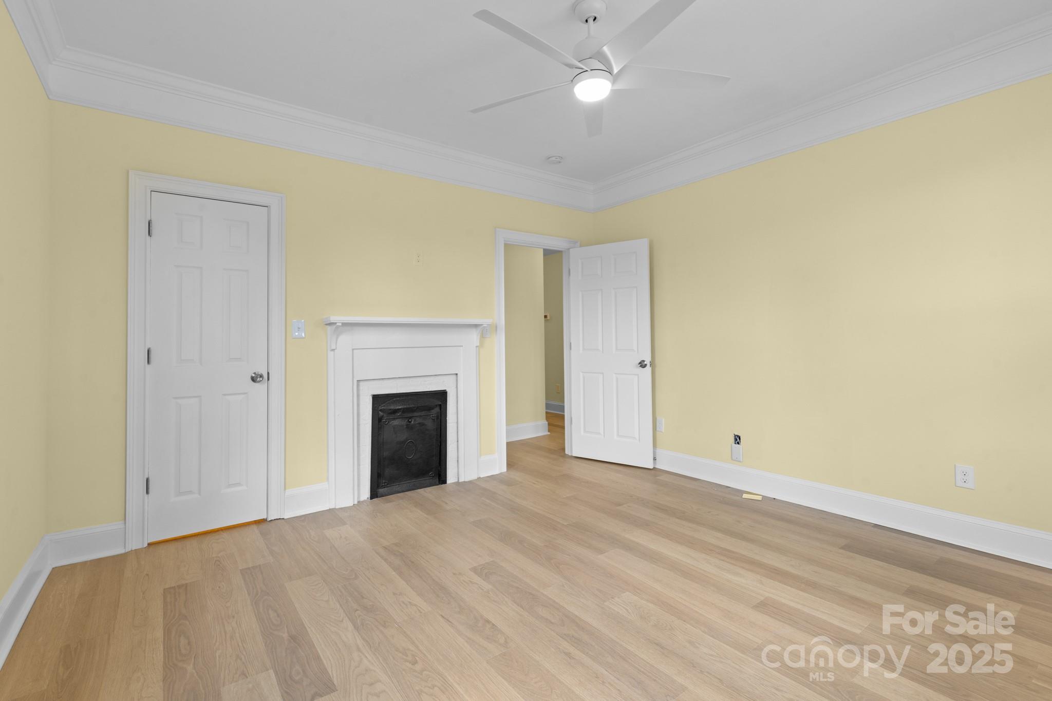 304 West Gay Street Lancaster, SC 29720 - Photo 17 of 28 a view of an empty room with a fireplace