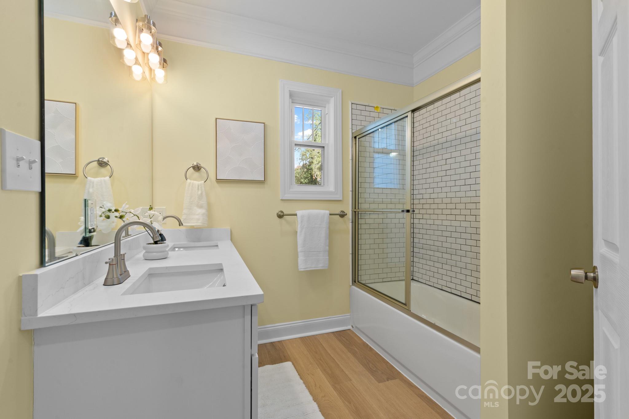 304 West Gay Street Lancaster, SC 29720 - Photo 19 of 28 a bathroom with a sink a shower and a mirror