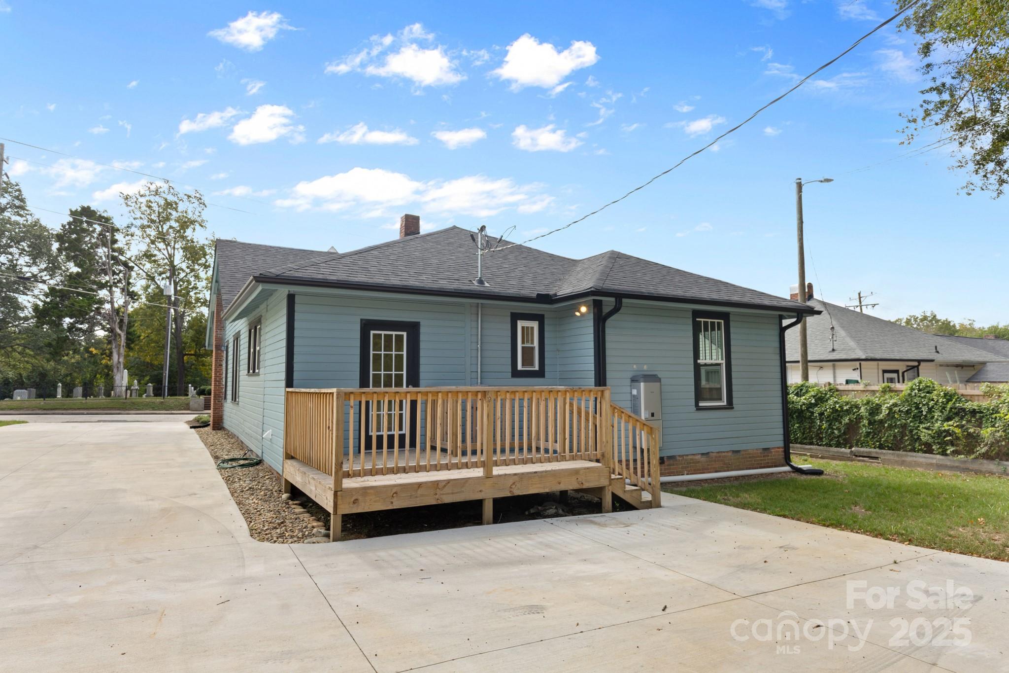304 West Gay Street Lancaster, SC 29720 - Photo 22 of 28 a view of backyard with a garden and deck