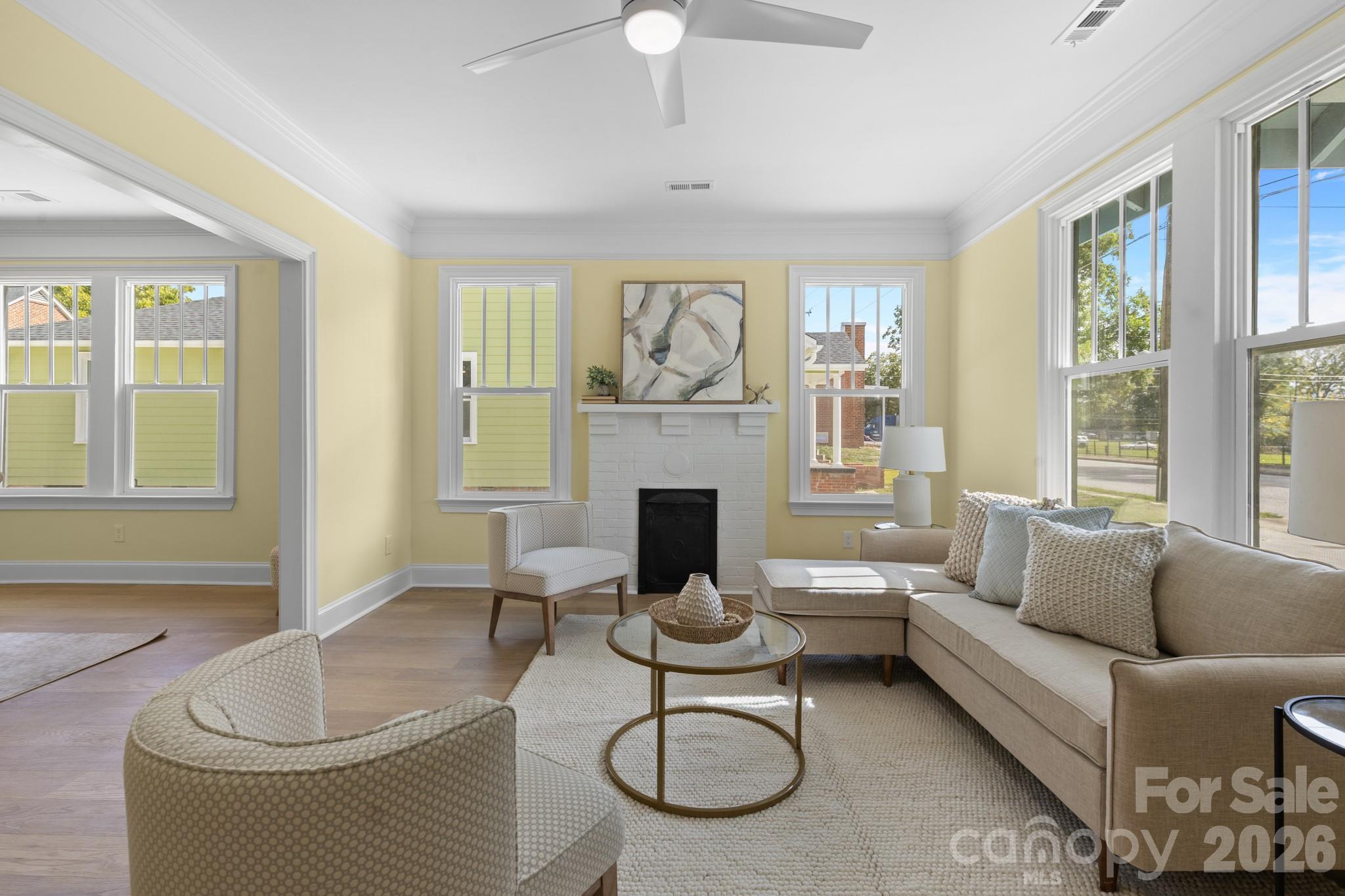 304 West Gay Street Lancaster, SC 29720 - Photo 4 of 28 a living room with furniture a fireplace and window