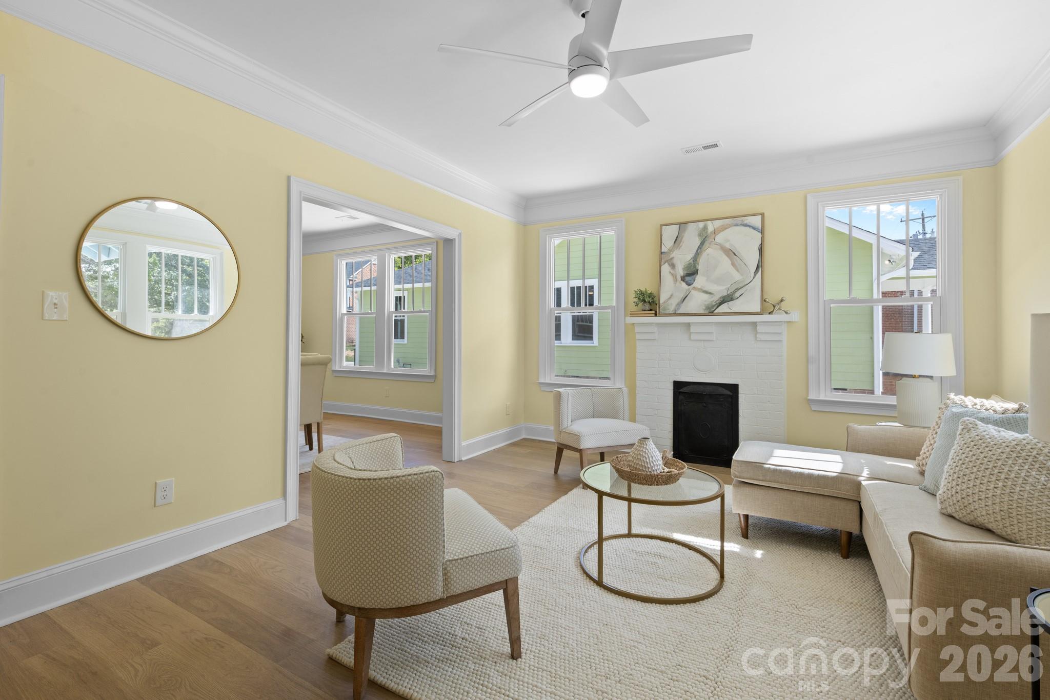 304 West Gay Street Lancaster, SC 29720 - Photo 6 of 28 a living room with furniture a fireplace and a window
