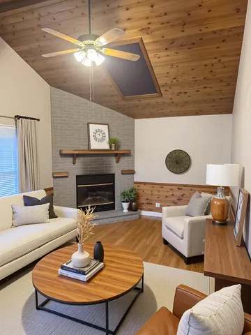 a living room with furniture and a fireplace