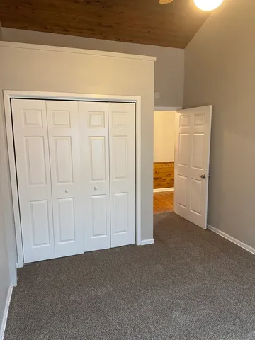 a view of backyard with a patio and potted plants