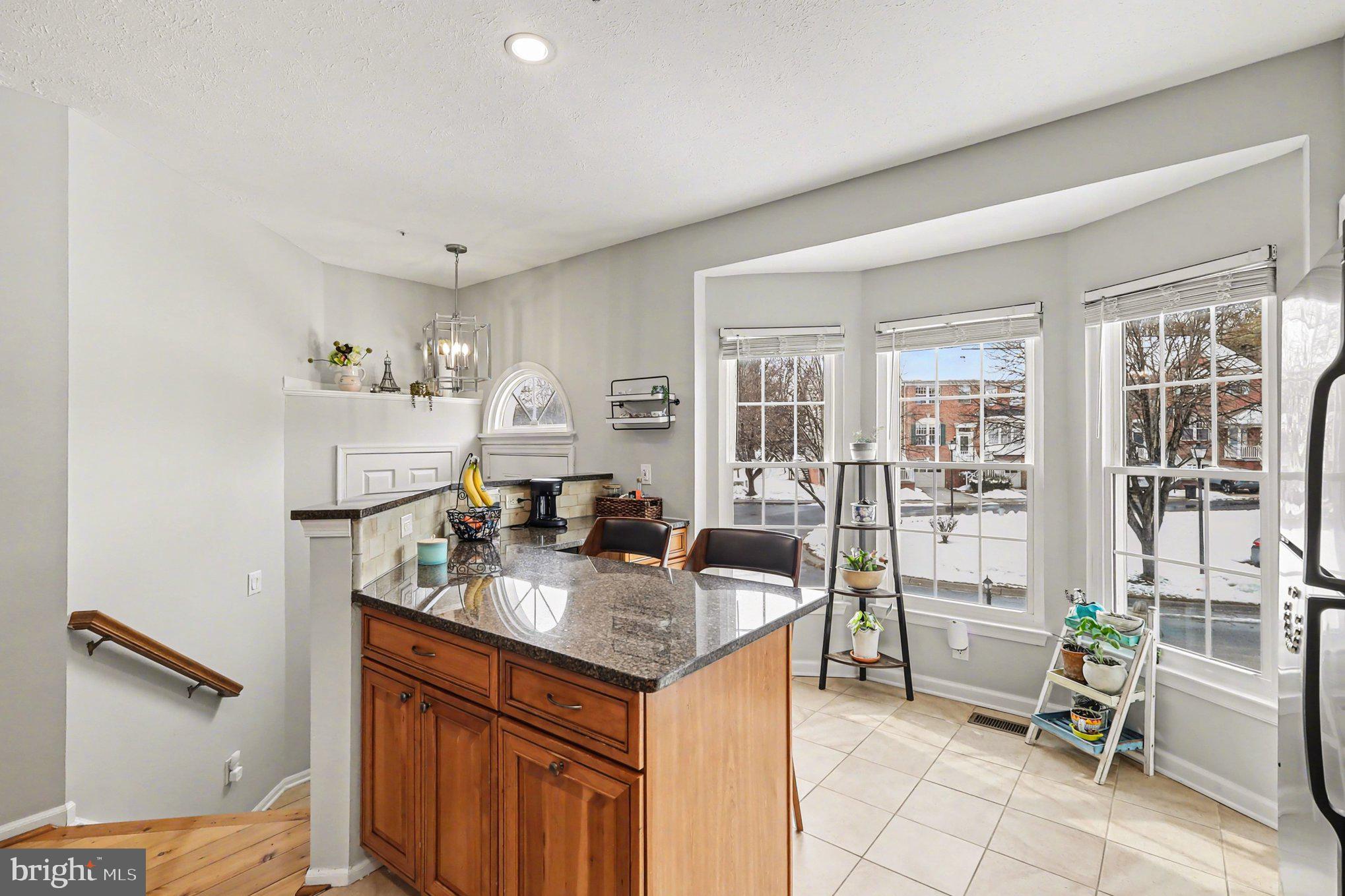 12607 Granite Ridge Drive North Potomac, MD 20878 - Photo 12 of 35 a kitchen with a sink cabinets and wooden floor