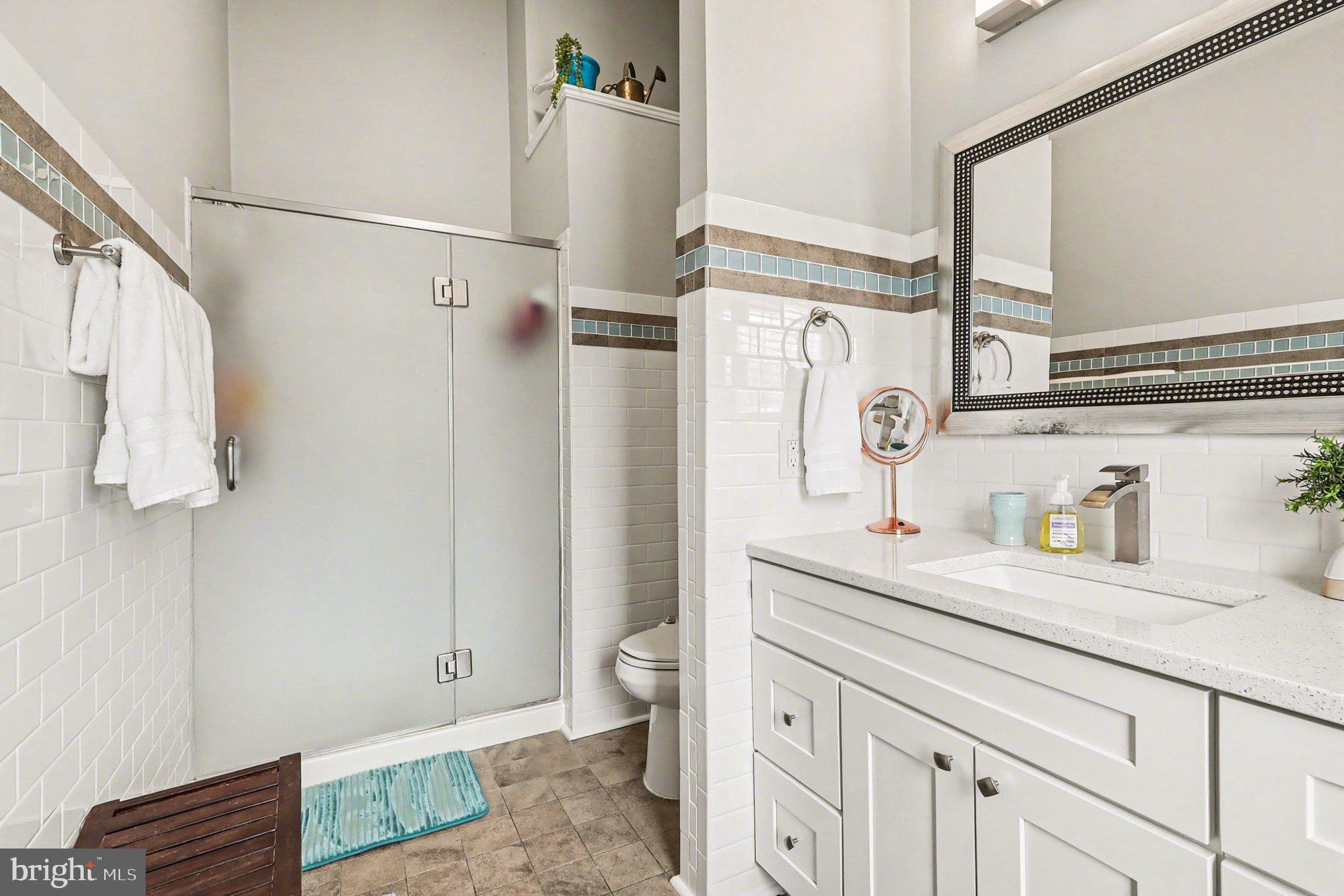 12607 Granite Ridge Drive North Potomac, MD 20878 - Photo 17 of 35 a bathroom with a sink a toilet and a mirror