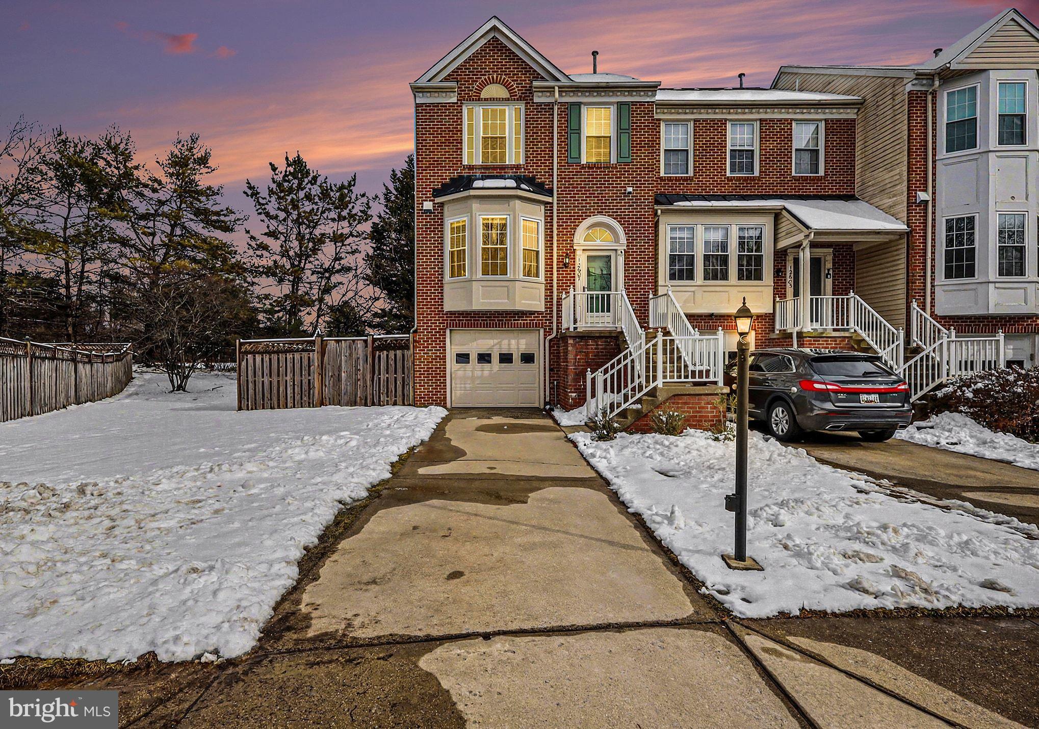 12607 Granite Ridge Drive North Potomac, MD 20878 - Photo 2 of 35 a front view of a residential apartment building with a yard