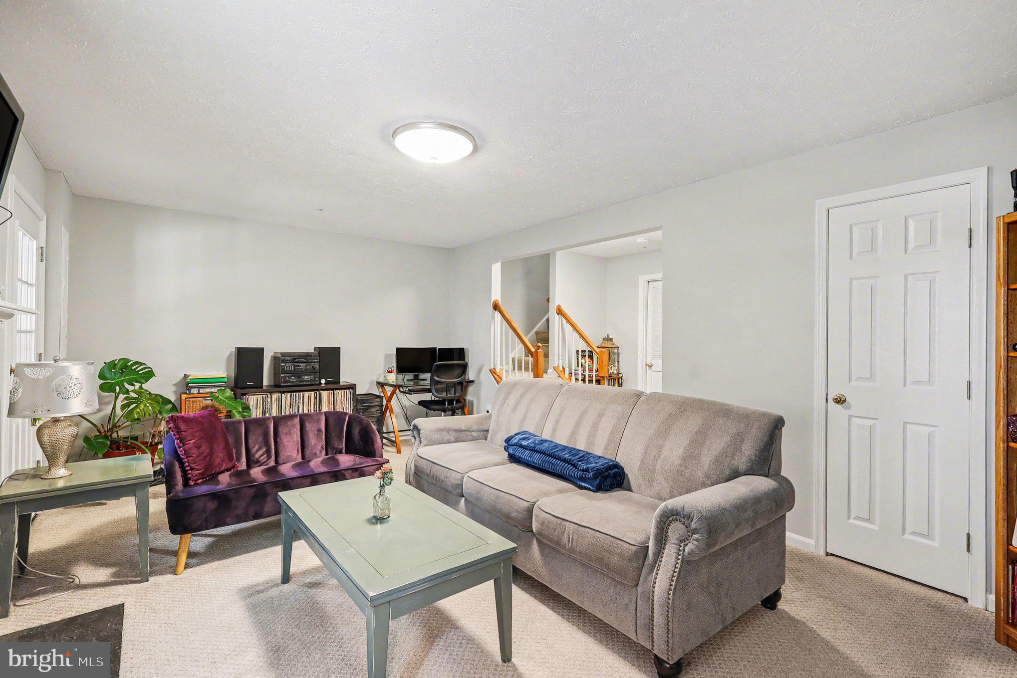 12607 Granite Ridge Drive North Potomac, MD 20878 - Photo 25 of 35 a living room with furniture and a flat screen tv