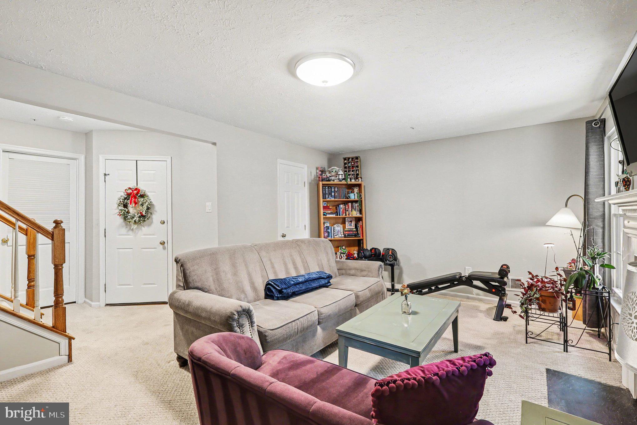 12607 Granite Ridge Drive North Potomac, MD 20878 - Photo 26 of 35 a living room with furniture and a couch