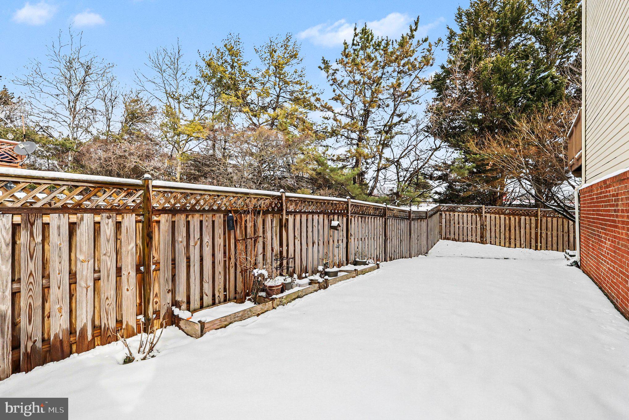 12607 Granite Ridge Drive North Potomac, MD 20878 - Photo 27 of 35 a view of backyard with wooden fence