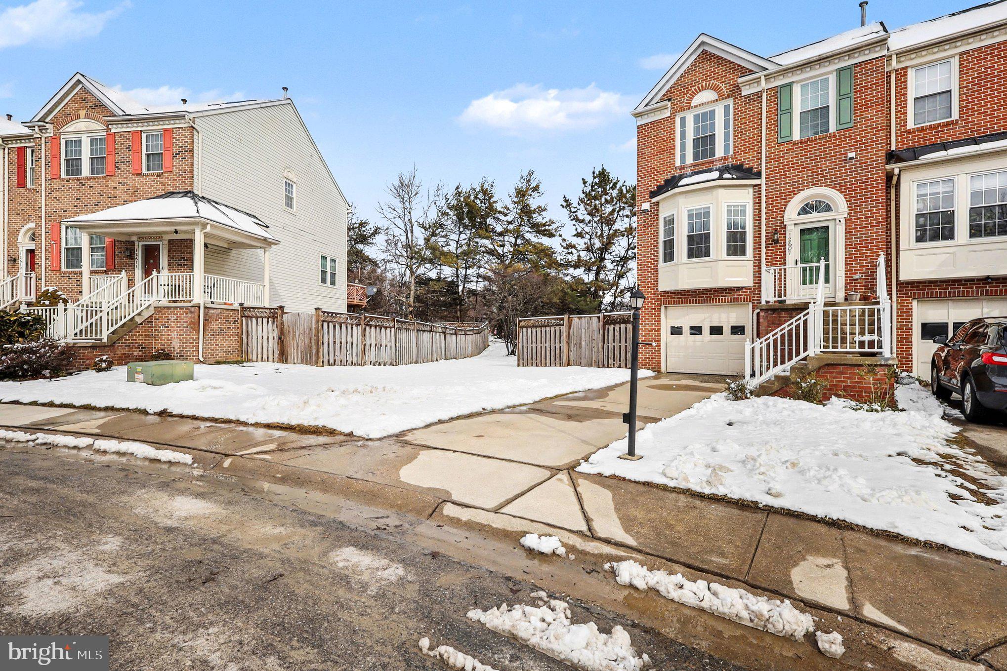 12607 Granite Ridge Drive North Potomac, MD 20878 - Photo 32 of 35 a front view of a house with a yard