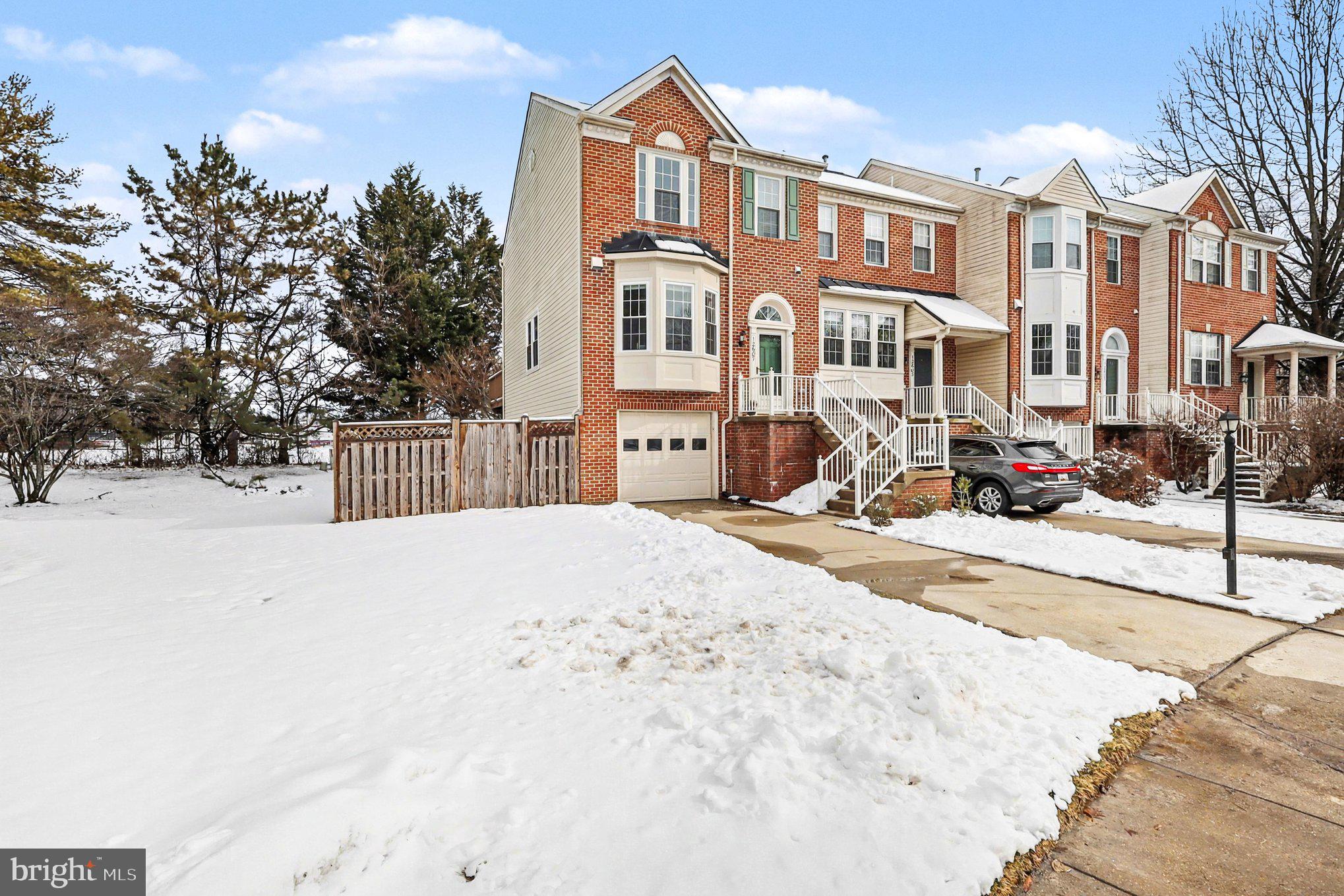 12607 Granite Ridge Drive North Potomac, MD 20878 - Photo 4 of 35 a view of a building with snow on the road