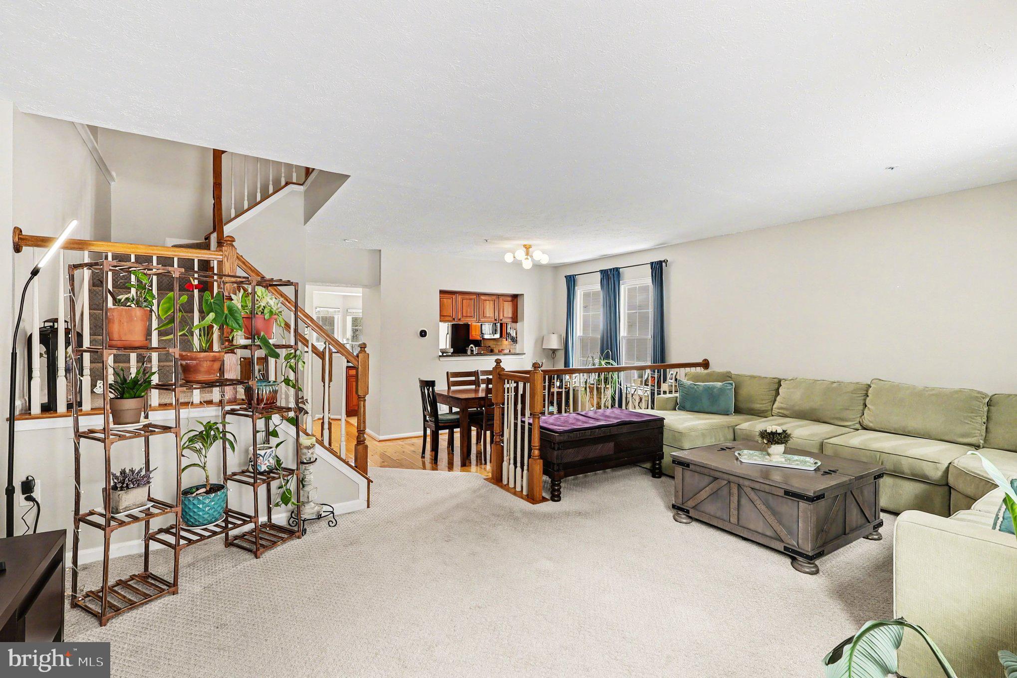 12607 Granite Ridge Drive North Potomac, MD 20878 - Photo 5 of 35 a living room with furniture and white walls