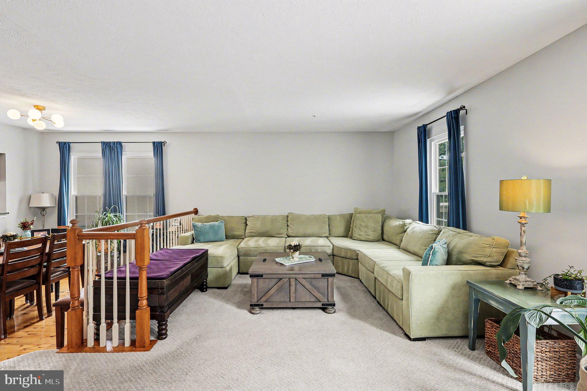 12607 Granite Ridge Drive North Potomac, MD 20878 - Photo 6 of 35 a living room with furniture fireplace and a window