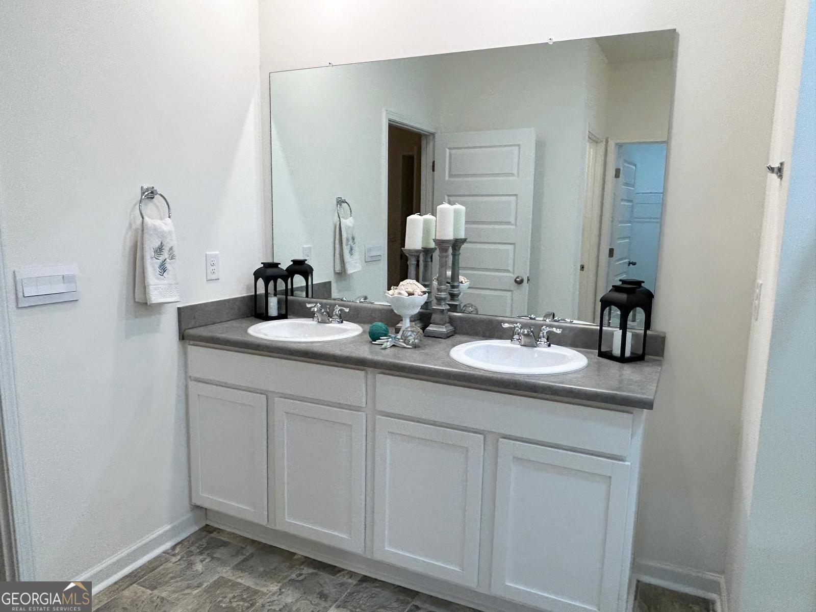 215 Barnyard Way Perry, GA 31069 - Photo 18 of 29 a bathroom with a sink and a mirror