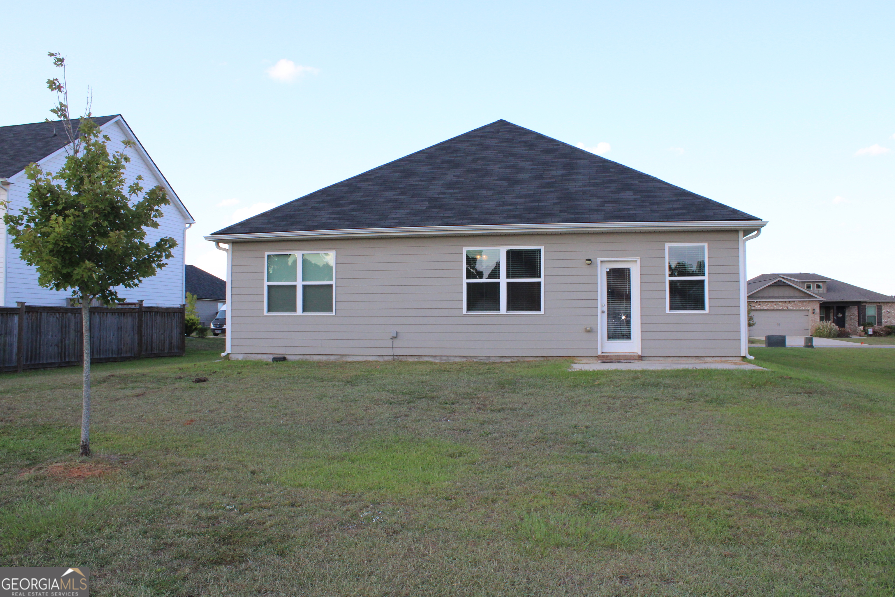 215 Barnyard Way Perry, GA 31069 - Photo 21 of 29 a view of a yard in front of a house with plants