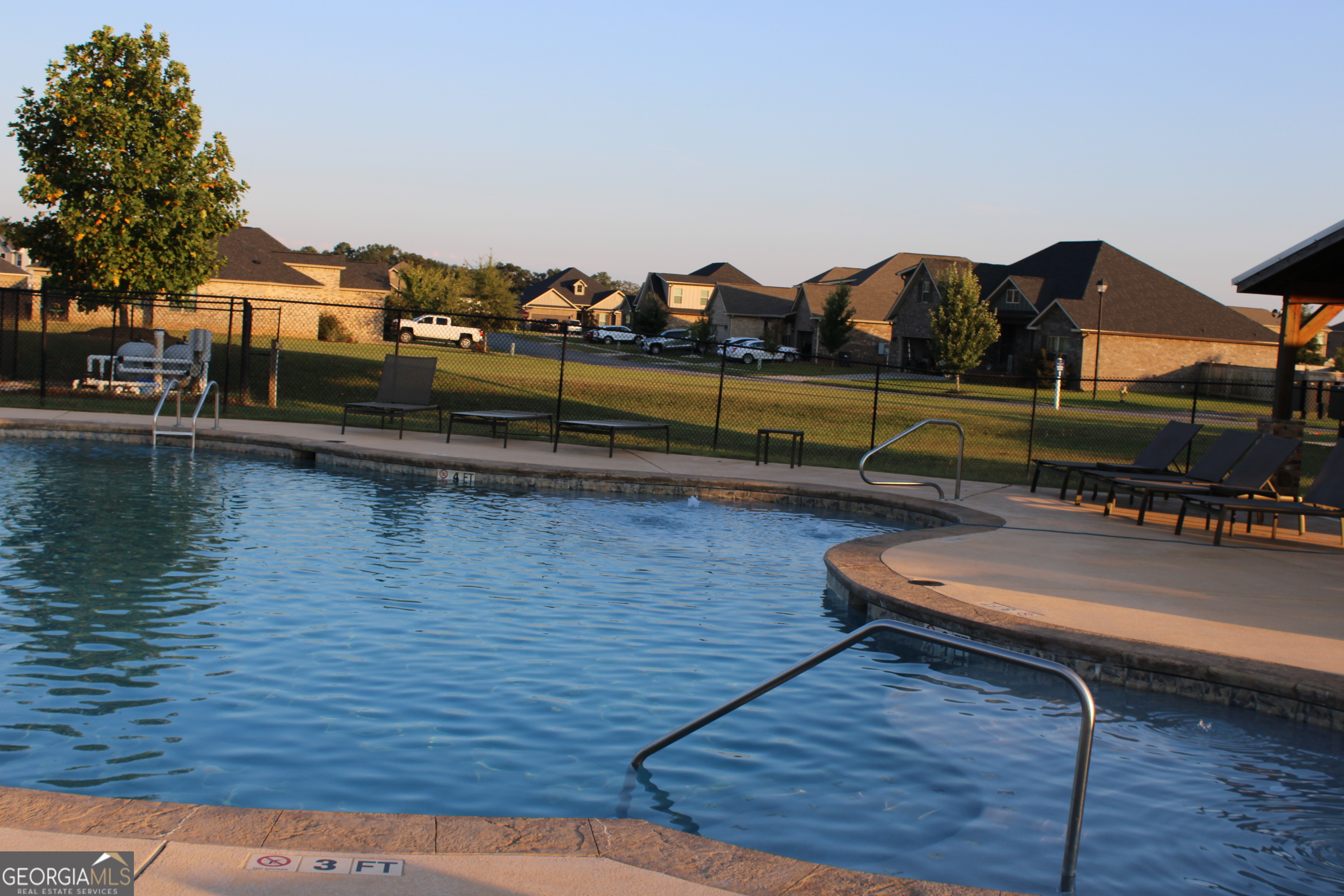 215 Barnyard Way Perry, GA 31069 - Photo 26 of 29 a view of swimming pool with seating space and barbeque oven