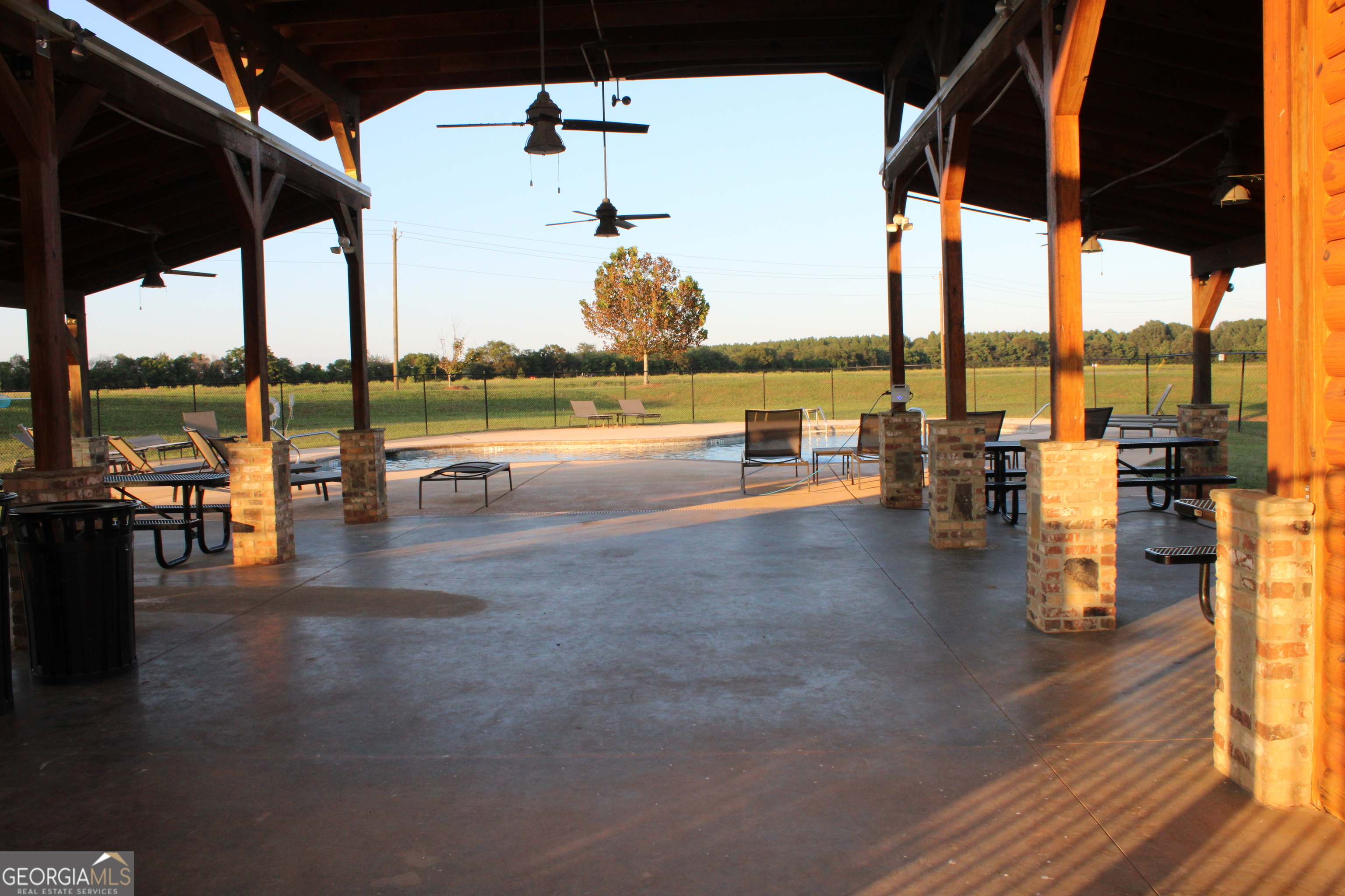 215 Barnyard Way Perry, GA 31069 - Photo 28 of 29 a view of a swimming pool with outdoor seating