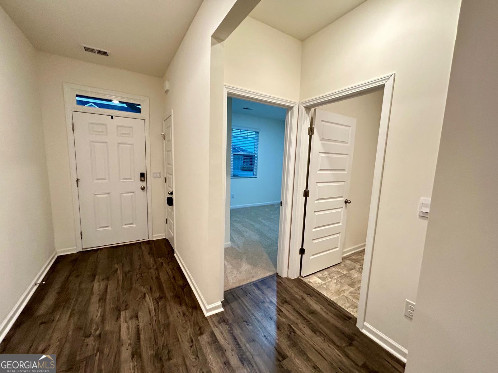 215 Barnyard Way Perry, GA 31069 - Photo 4 of 29 wooden floor with white walls