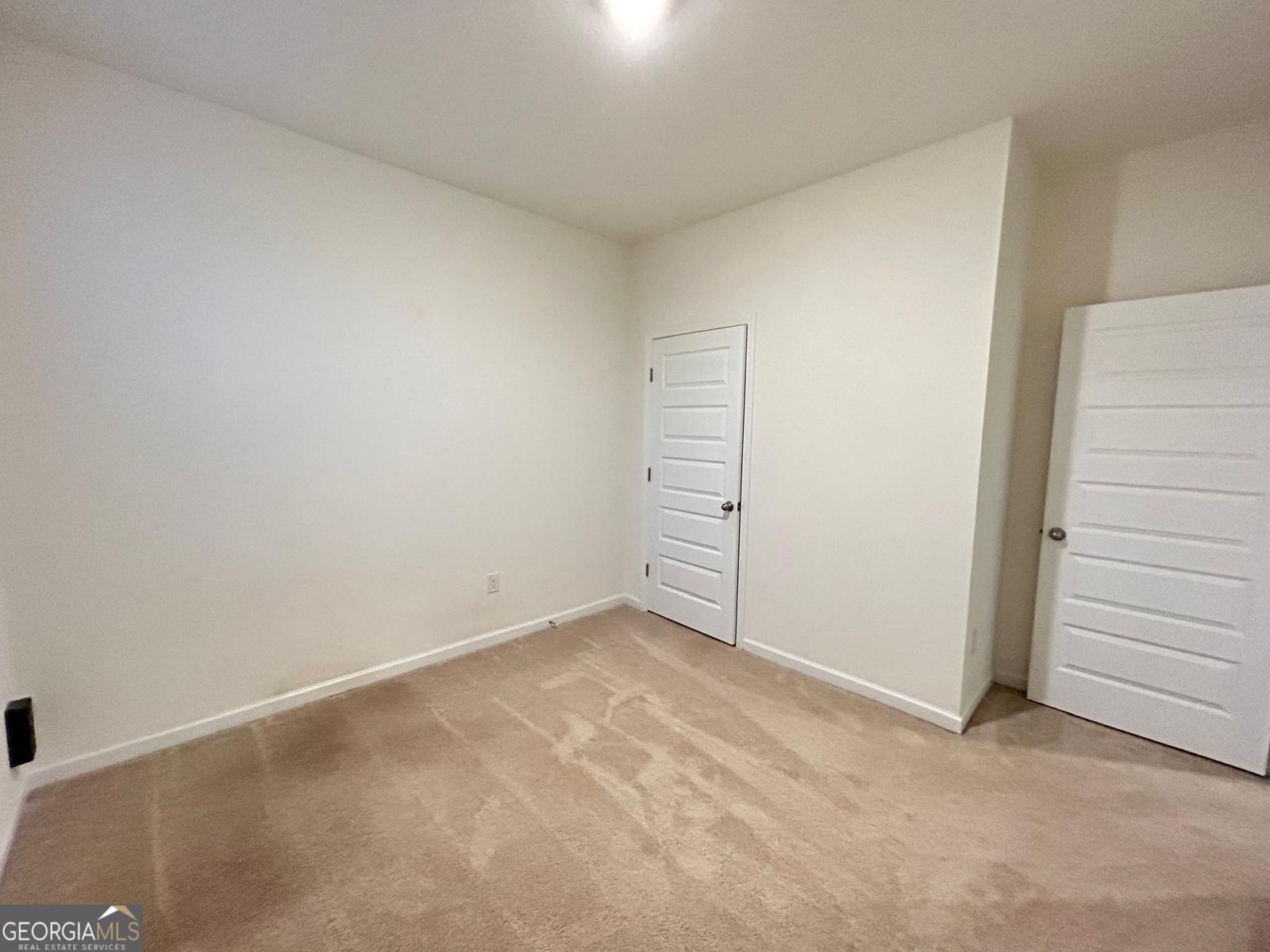 215 Barnyard Way Perry, GA 31069 - Photo 9 of 29 an empty room with a hallway