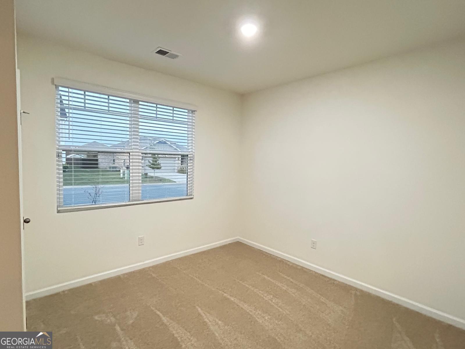 215 Barnyard Way Perry, GA 31069 - Photo 10 of 29 an empty room with a window