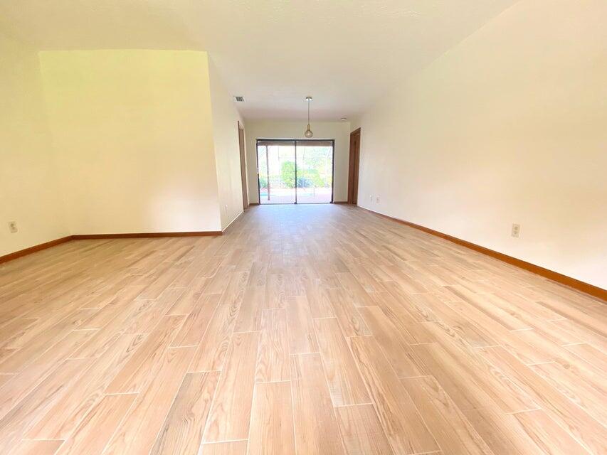 5585 Pennock Point Road Jupiter, FL 33458 - Photo 8 of 19 a view of an empty room and window