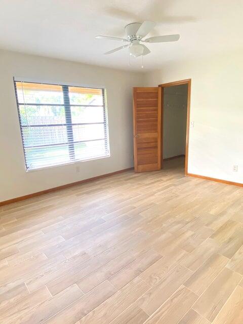 5585 Pennock Point Road Jupiter, FL 33458 - Photo 10 of 19 a view of an empty room with a window