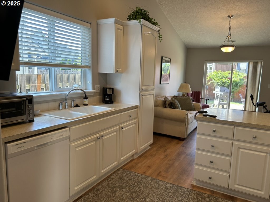 736 Kelsey Loop Molalla, OR 97038 - Photo 7 of 21 a spacious en suite bathroom with a double vanity sink a mirror a window and a shower