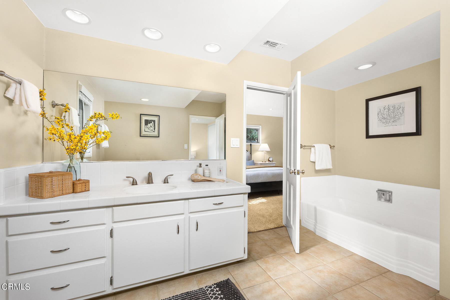 1961 Oak Street South Pasadena, CA 91030 - Photo 11 of 19 a spacious bathroom with a double vanity sink a mirror a bathtub and next to a window