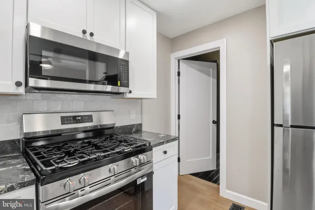 a kitchen with a stove and a microwave