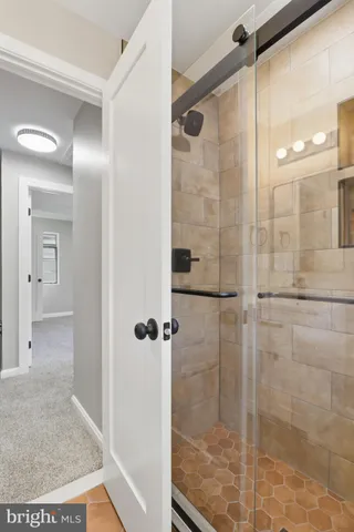 a white toilet sitting next to a bathroom sink