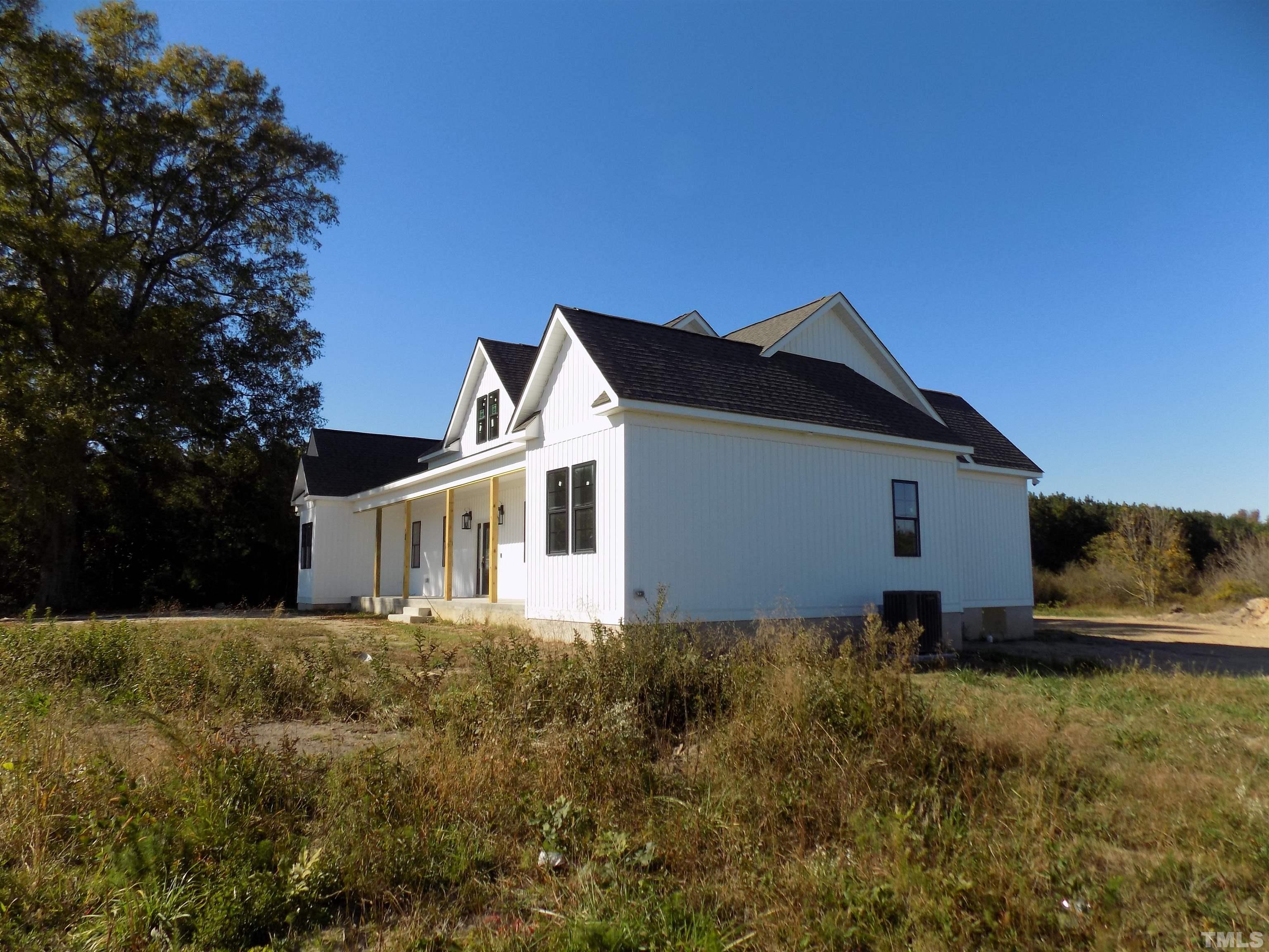 4561 Highway 56 Louisburg, NC 27549 - Photo 8 of 13 a house view with a outdoor space
