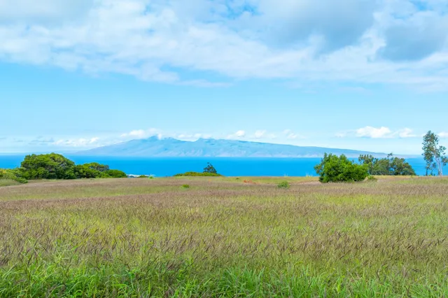 a view of an ocean beach and mountain view