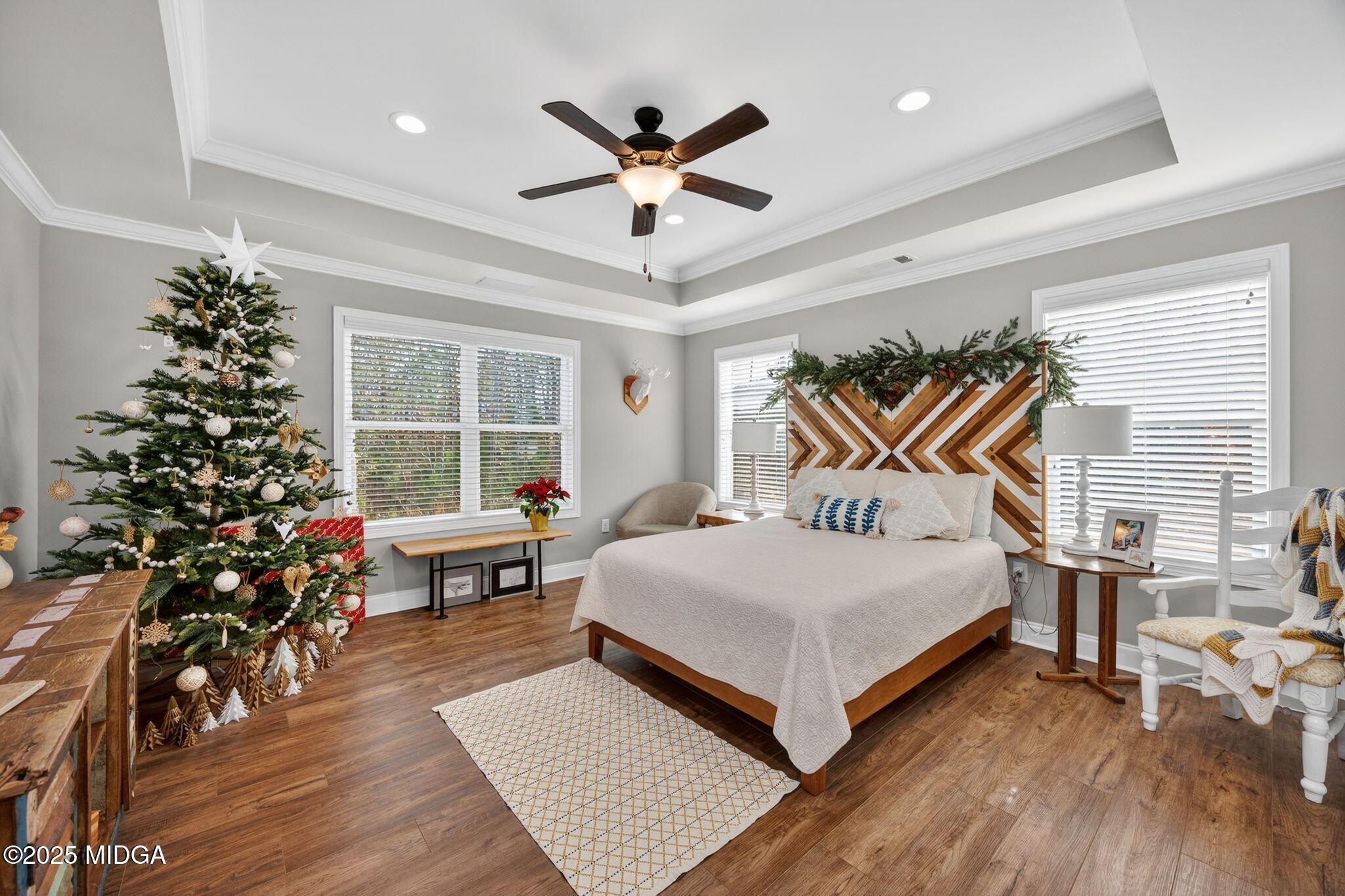 153 Jackson Drive Forsyth, GA 31029 - Photo 13 of 26 a bedroom with a bed and wooden floor