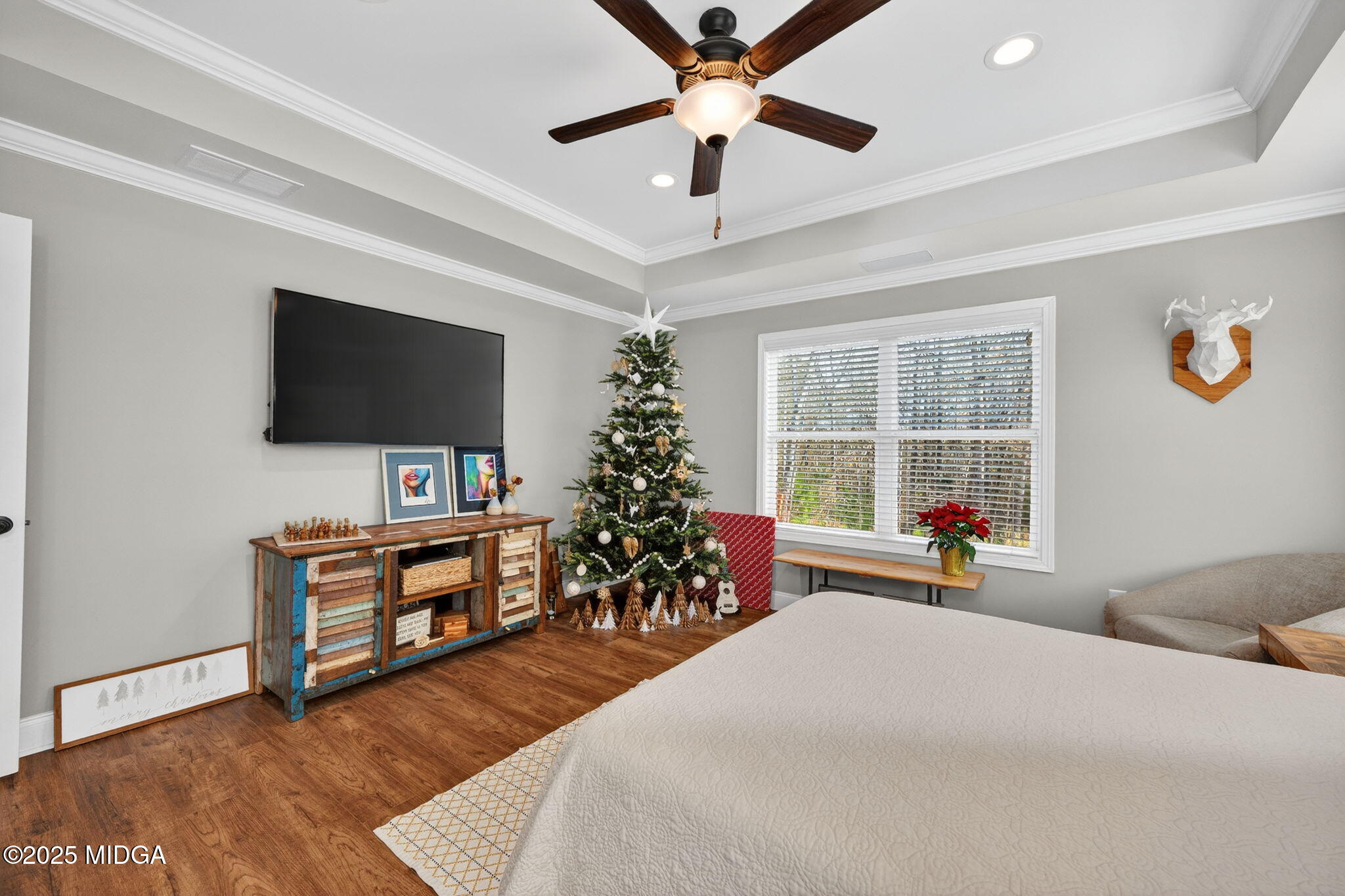 153 Jackson Drive Forsyth, GA 31029 - Photo 14 of 26 a bedroom with a bed and a flat screen tv