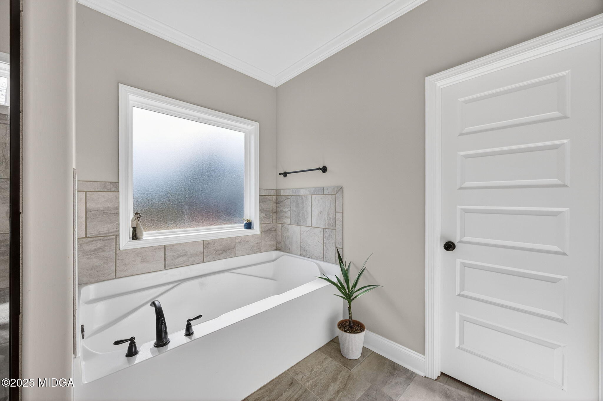 153 Jackson Drive Forsyth, GA 31029 - Photo 16 of 26 a bathroom with a bathtub and a shower