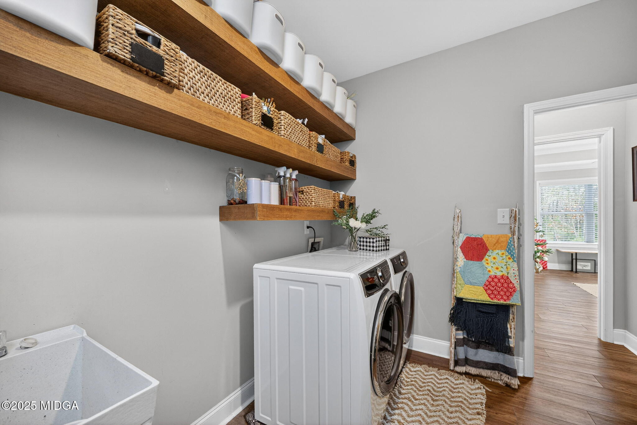 153 Jackson Drive Forsyth, GA 31029 - Photo 18 of 26 a view of storage and utility room with washer and dryer