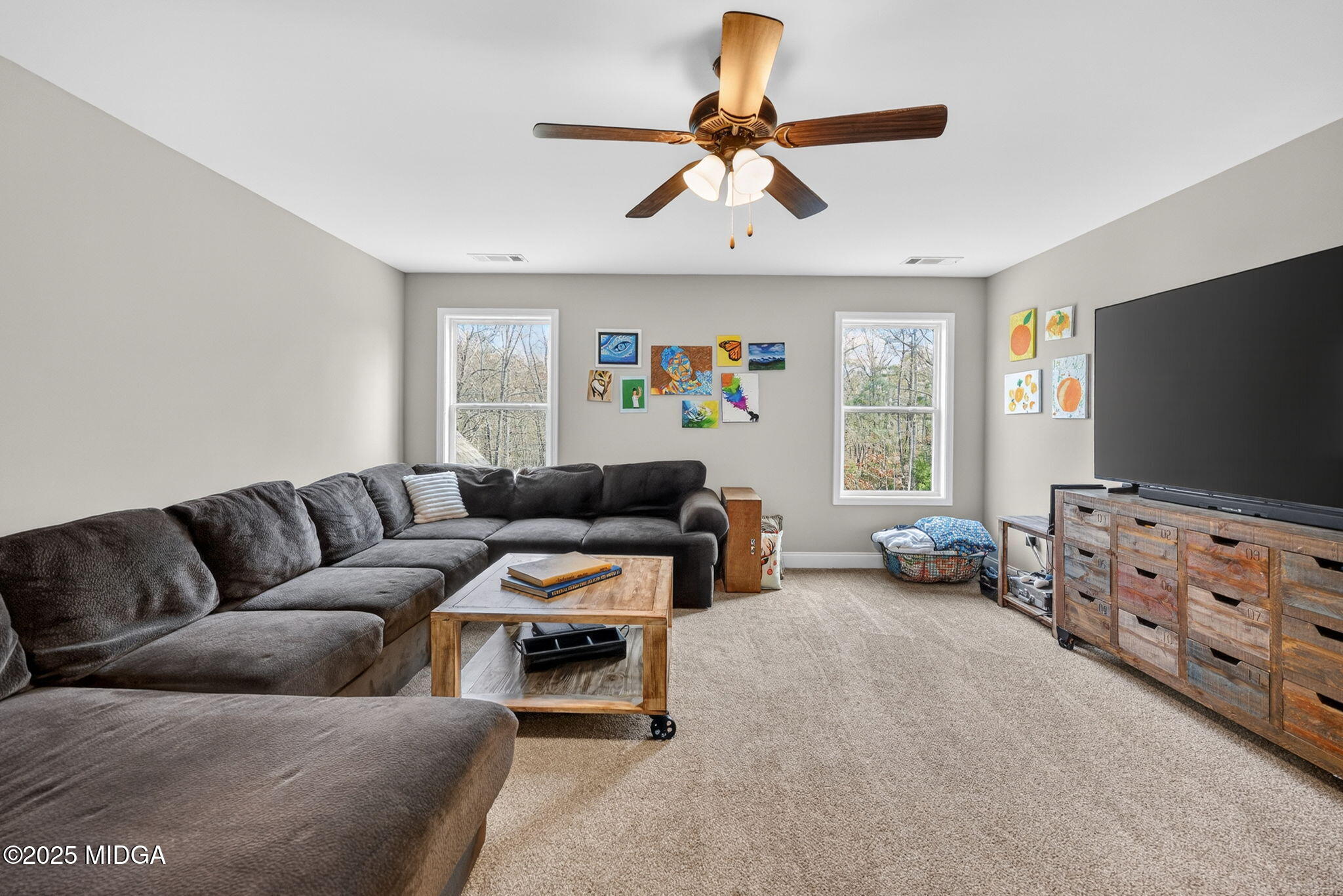 153 Jackson Drive Forsyth, GA 31029 - Photo 20 of 26 a living room with furniture and a flat screen tv